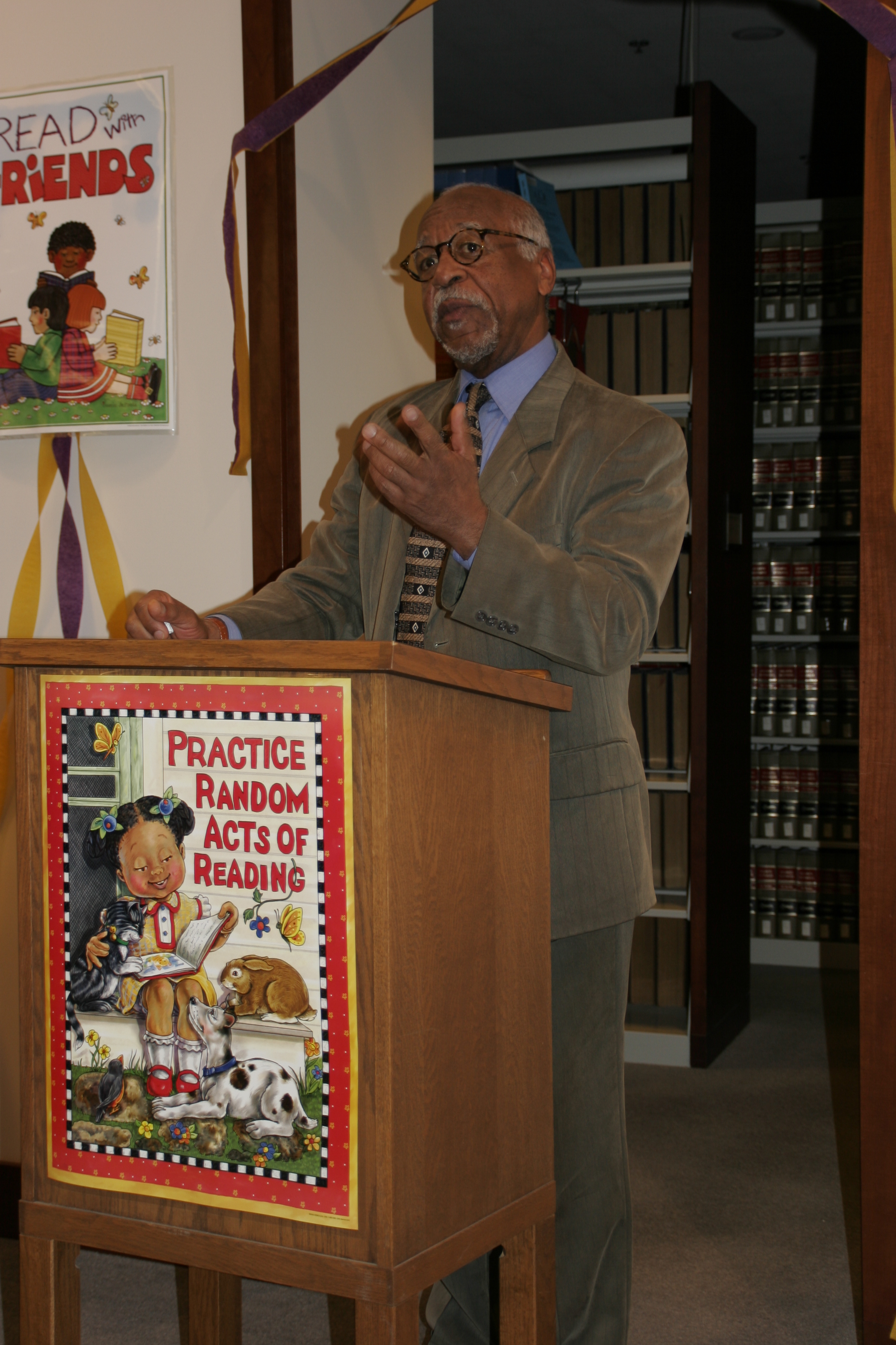Marvin Anderson speaking from a podium.