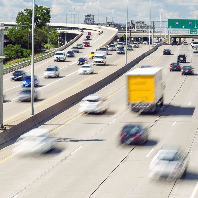 A highway with cars traveling in both directions.